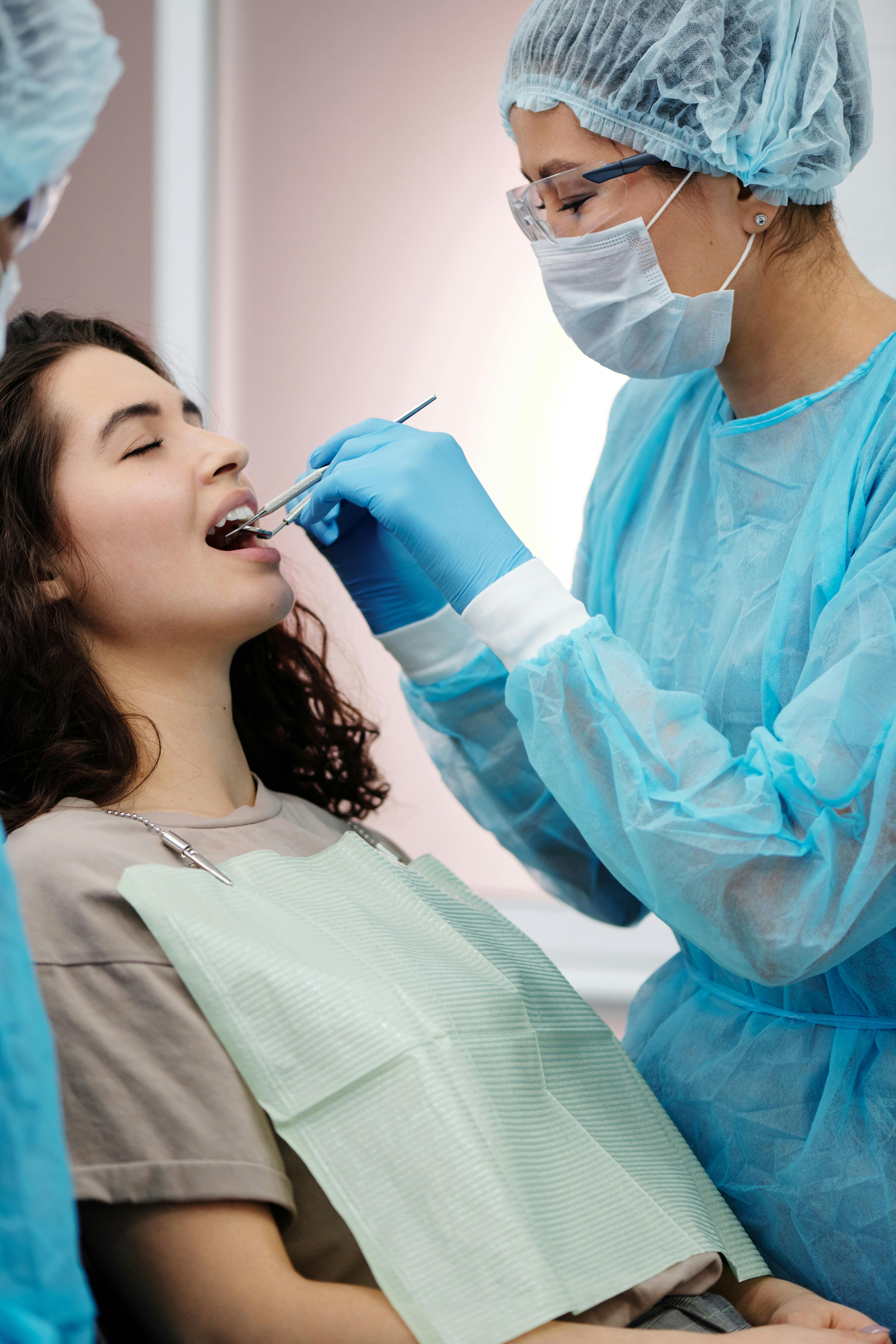 Dental care professional with patient